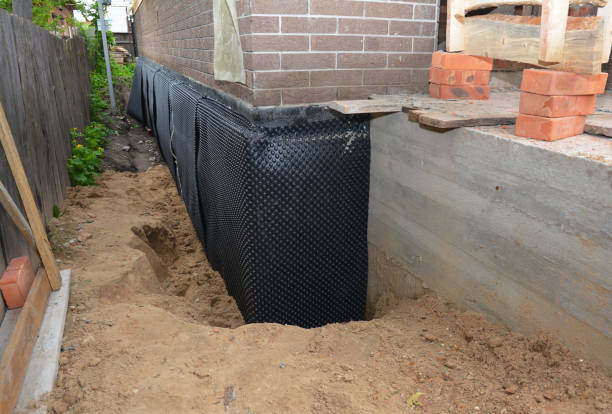 Happy homeowners after waterproofing job in Climax